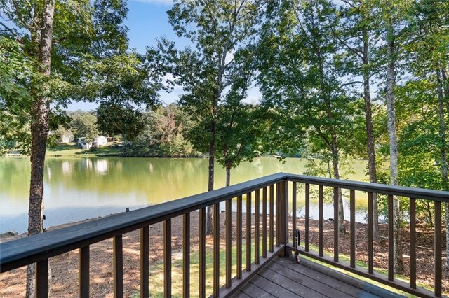 wooden deck with a water view