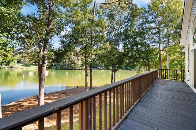 wooden deck featuring a water view