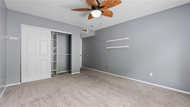 47 Arbor End, Smyrna, GA 30080 - unfurnished bedroom featuring carpet floors, a closet, a textured ceiling, and a ceiling fan