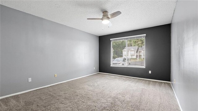 47 Arbor End, Smyrna, GA 30080 - spare room featuring ceiling fan, carpet, and a textured ceiling
