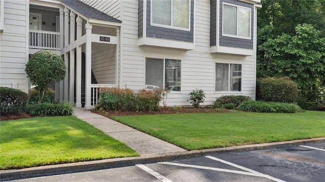 47 Arbor End, Smyrna, GA 30080 - doorway to property with uncovered parking and a lawn