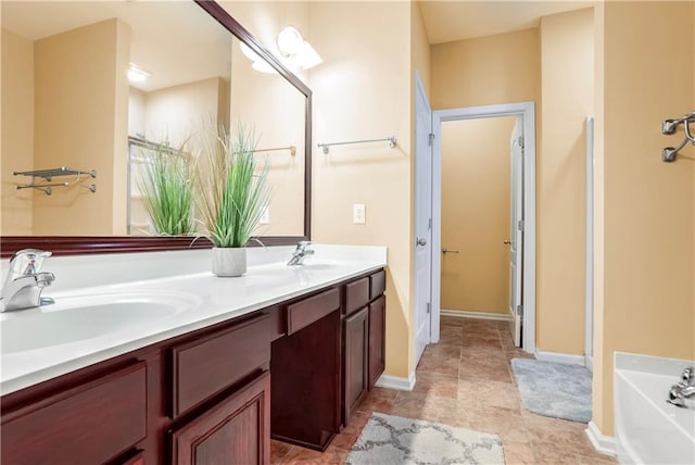 bathroom featuring a tub and vanity