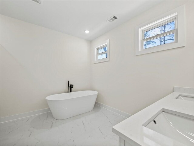 bathroom featuring vanity, a tile shower, and toilet