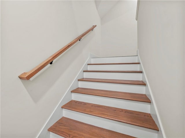 bonus room featuring vaulted ceiling and light hardwood / wood-style floors