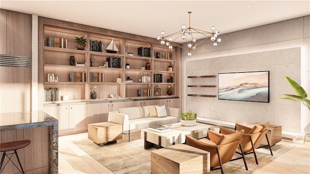 sitting room featuring light wood finished floors, built in features, and a notable chandelier