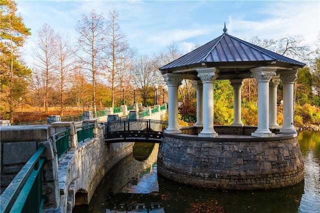 surrounding community featuring a water view and a gazebo