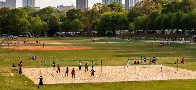 surrounding community featuring volleyball court and a yard