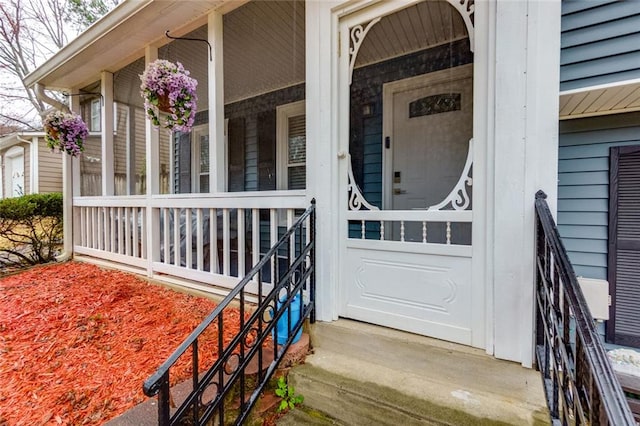 doorway to property featuring covered porch