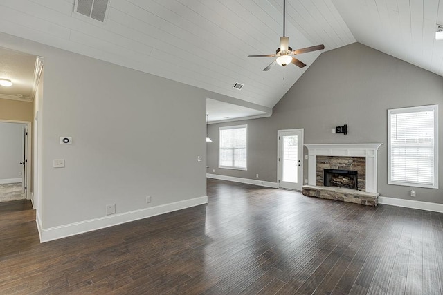 63 Emma Ln, Winder, GA 30680 - unfurnished living room featuring a ceiling fan, baseboards, a stone fireplace, dark wood-style flooring, and high vaulted ceiling