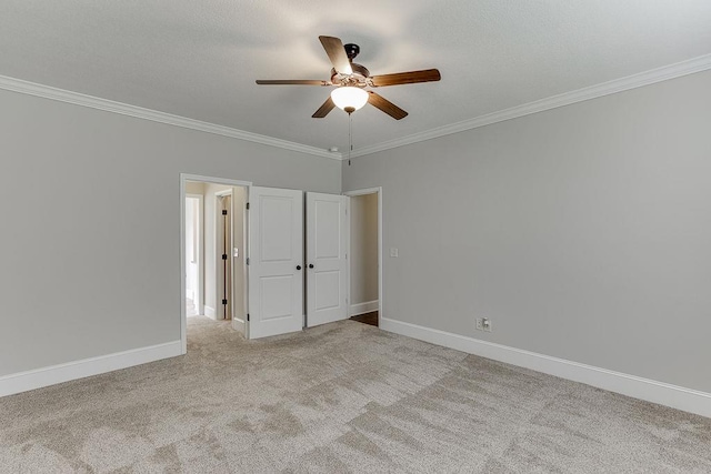 63 Emma Ln, Winder, GA 30680 - unfurnished bedroom with crown molding, carpet floors, baseboards, and ceiling fan
