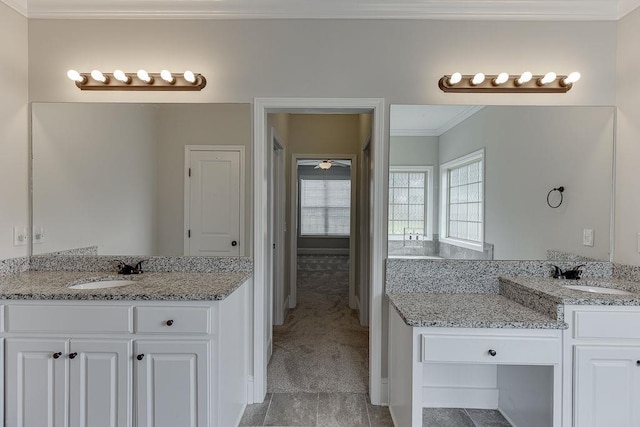 63 Emma Ln, Winder, GA 30680 - full bathroom featuring crown molding, two vanities, and baseboards
