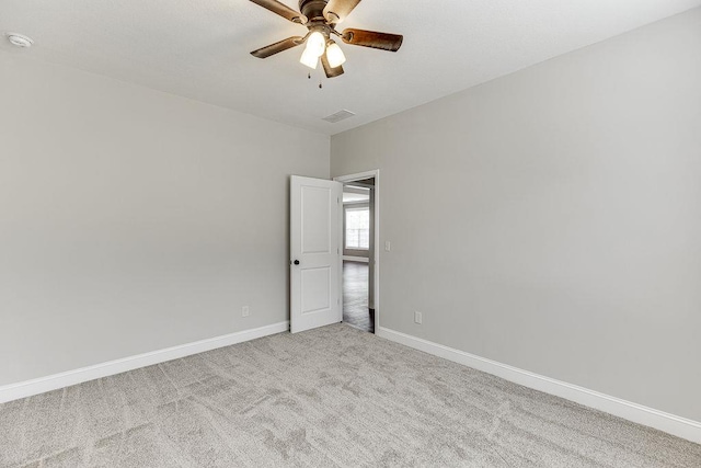 63 Emma Ln, Winder, GA 30680 - spare room with a ceiling fan, baseboards, a smoke detector, and carpet floors