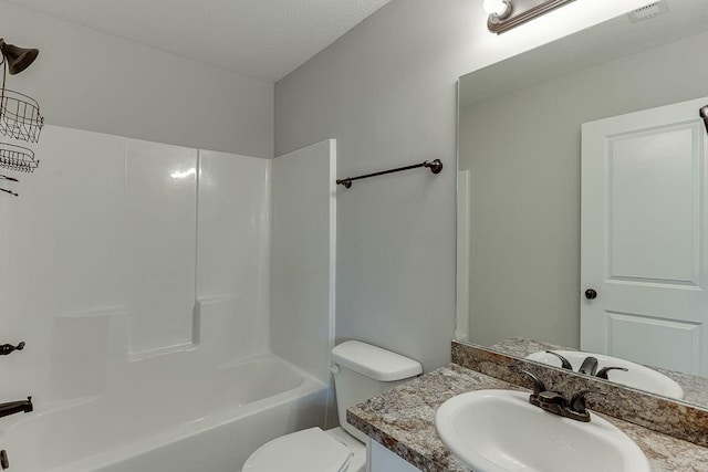 63 Emma Ln, Winder, GA 30680 - bathroom featuring vanity, toilet, and bathing tub / shower combination