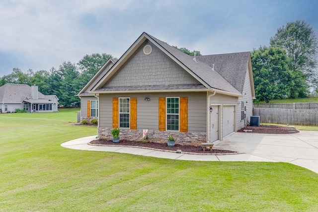 63 Emma Ln, Winder, GA 30680 - craftsman-style home featuring central AC unit, concrete driveway, stone siding, and roof with shingles