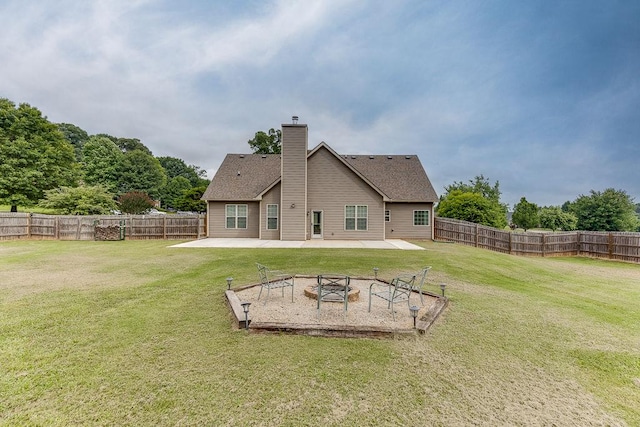 63 Emma Ln, Winder, GA 30680 - back of property with a fire pit, a patio area, and a chimney