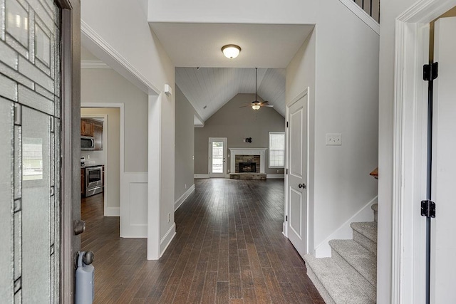 63 Emma Ln, Winder, GA 30680 - entrance foyer with ceiling fan, dark wood-style floors, a fireplace, lofted ceiling, and baseboards