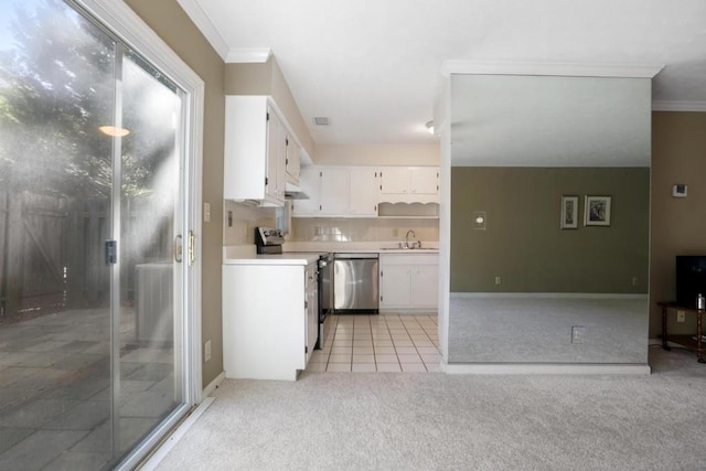 kitchen with stainless steel appliances, light carpet, white cabinetry, crown molding, and light countertops