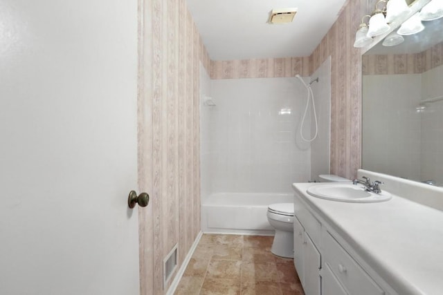full bathroom with vanity, bathtub / shower combination, baseboards, toilet, and visible vents