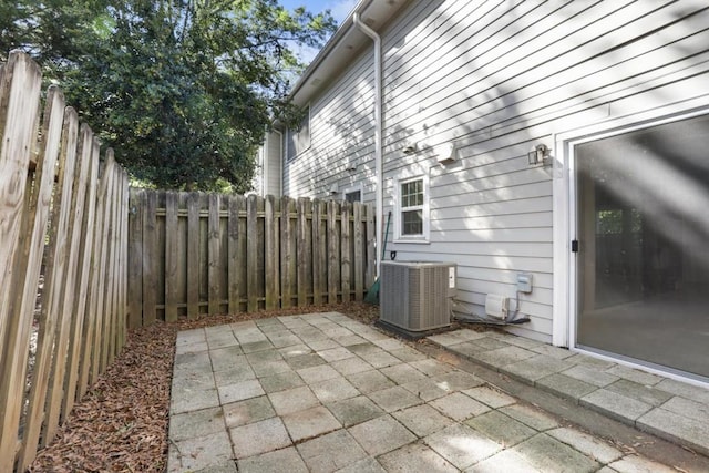 view of patio / terrace featuring fence and cooling unit