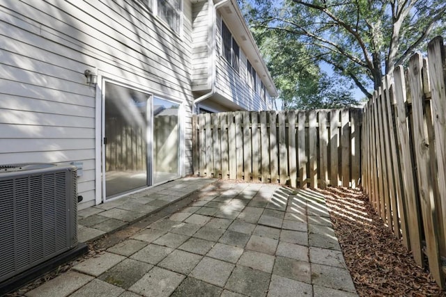 view of patio / terrace with a fenced backyard and cooling unit