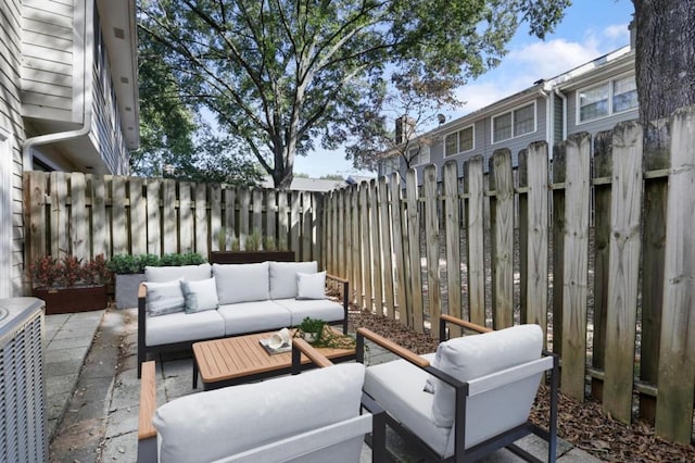view of patio / terrace featuring a fenced backyard and an outdoor living space