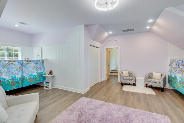 bedroom featuring vaulted ceiling and light hardwood / wood-style floors