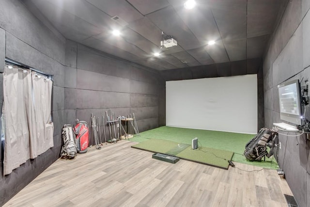 game room featuring golf simulator and light hardwood / wood-style floors