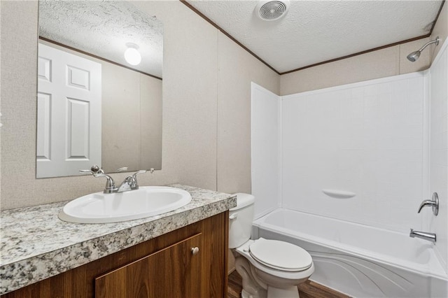 bathroom featuring wood finished floors, a textured ceiling, vanity, shower / tub combination, and toilet