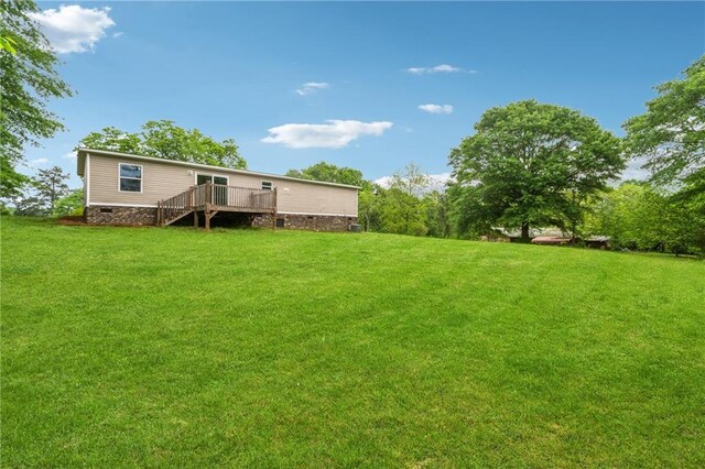 view of yard with a wooden deck