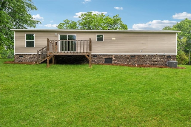 back of house featuring crawl space, stairs, a yard, and a wooden deck