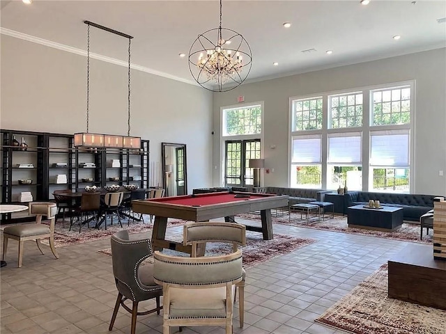 game room featuring light tile patterned floors, pool table, ornamental molding, and a towering ceiling