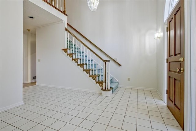 tiled entryway with ornamental molding