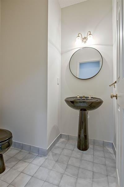 bathroom featuring tile patterned flooring