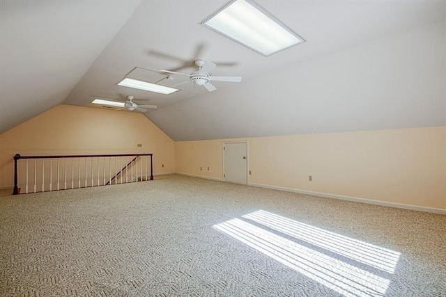 additional living space with vaulted ceiling, carpet flooring, and ceiling fan