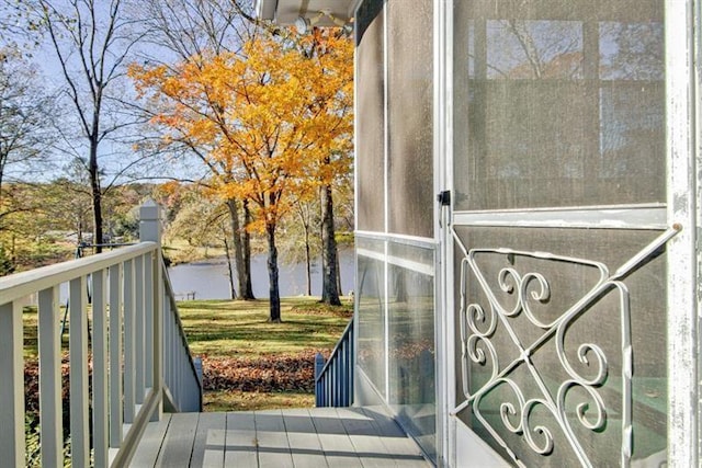 balcony featuring a water view