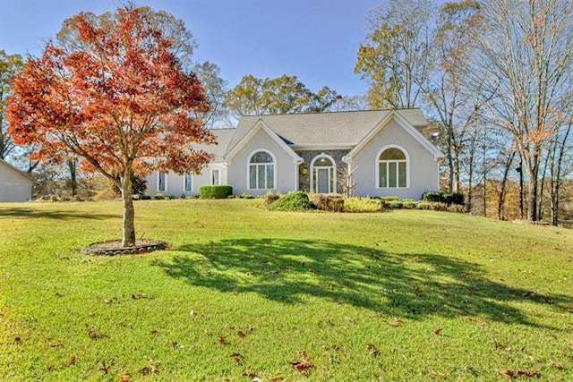 ranch-style home with a front yard