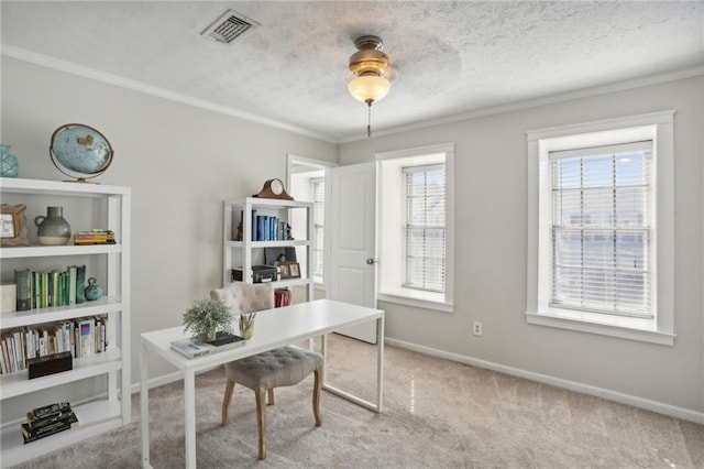 office featuring ornamental molding, a wealth of natural light, and light colored carpet