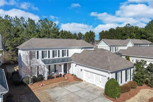 view of front of house featuring a garage and covered porch