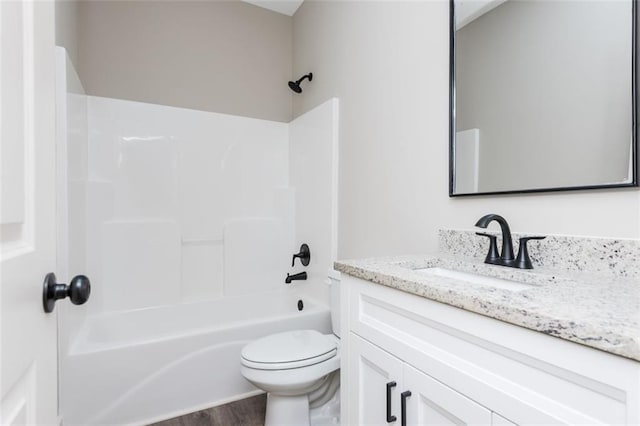 bathroom featuring shower / bathtub combination, toilet, wood finished floors, and vanity