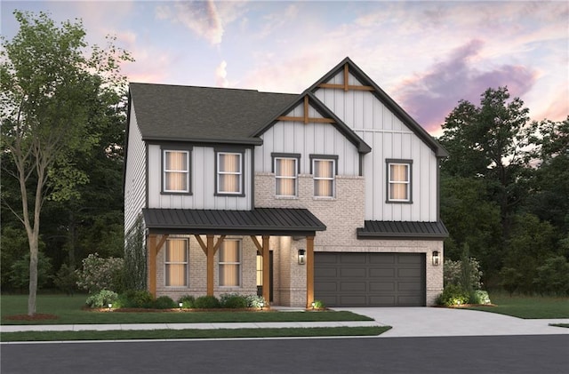 modern inspired farmhouse with board and batten siding, a standing seam roof, brick siding, and driveway