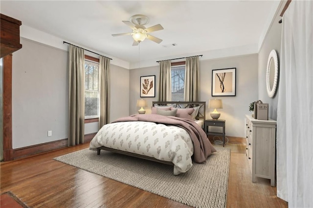 bedroom with ceiling fan and light hardwood / wood-style flooring