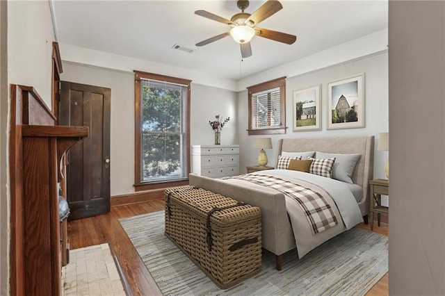 bedroom featuring wood-type flooring and ceiling fan