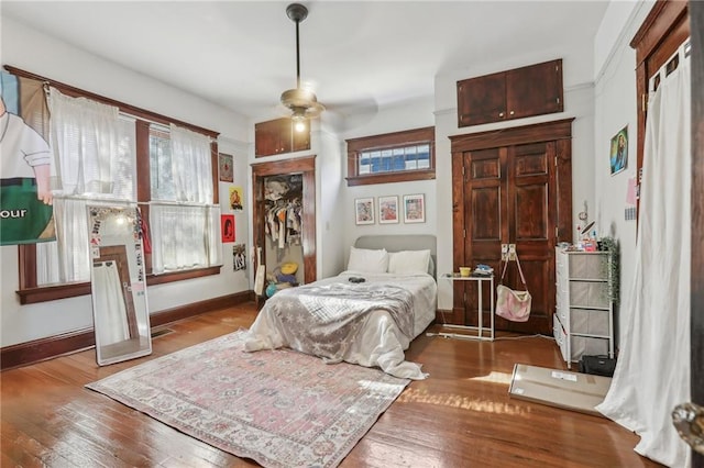 bedroom featuring hardwood / wood-style floors and ceiling fan