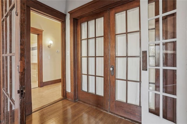 doorway featuring hardwood / wood-style flooring and french doors