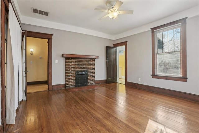 unfurnished living room with hardwood / wood-style flooring and ceiling fan