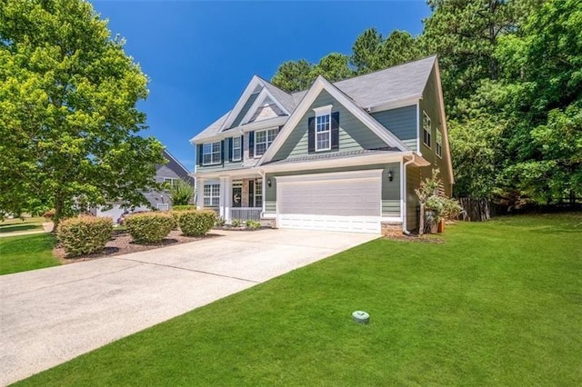 view of front of home with a garage and a front lawn