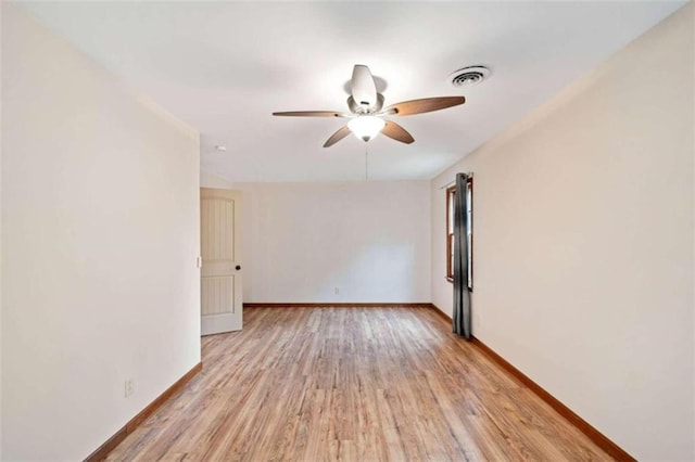 spare room featuring light hardwood / wood-style floors and ceiling fan