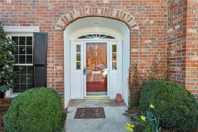 entrance to property with brick siding