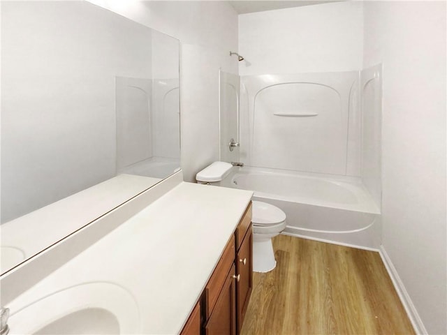 full bathroom with toilet, vanity, shower / bathing tub combination, and hardwood / wood-style flooring