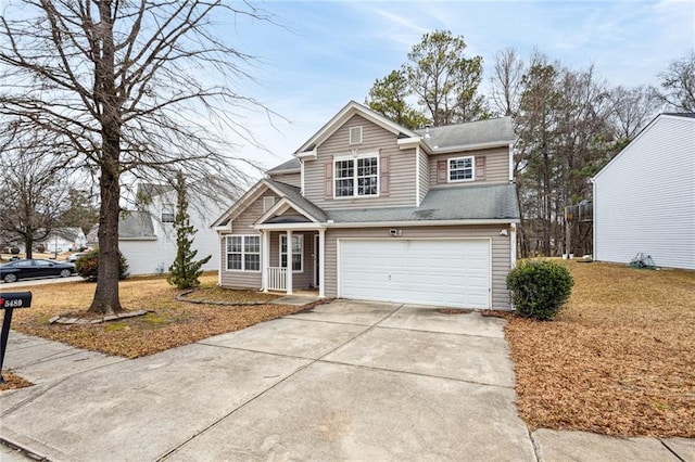 traditional-style home featuring concrete driveway and an attached garage